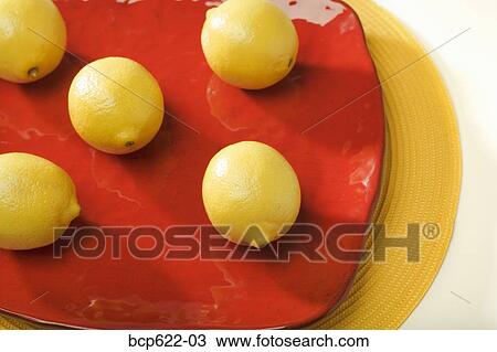 Lemons on red platter View Large Photo Image Stock Image - Lemons on red platter. Fotosearch