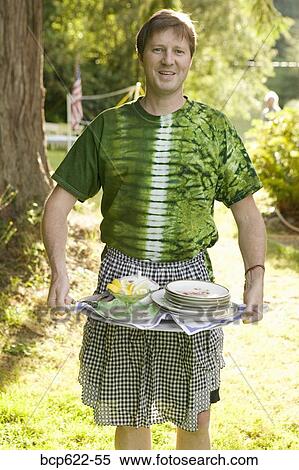 Man in apron with serving tray outside View Large Photo Image Stock Photography - Man in apron with serving tray outside. Fotosearch