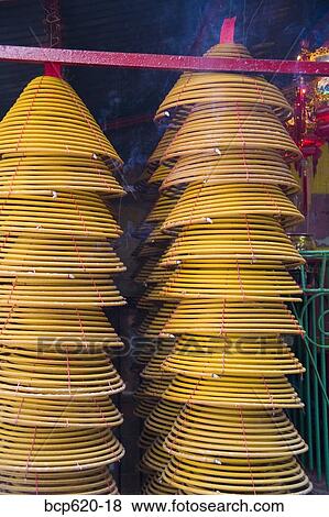 Many hanging incense coils burning View Large Photo Image Stock Photo - Many hanging incense coils burning. Fotosearch