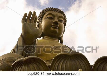 Massive statue of seated Buddha with clouds View Large Photo Image Picture - Massive statue of seated Buddha with clouds. Fotosearch