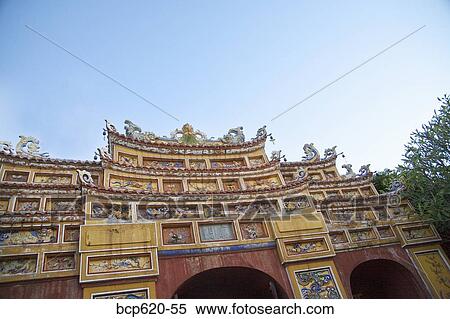 Ornate façade of Vietnamese citadel with sky View Large Photo Image Stock Photography - Ornate façade of Vietnamese citadel with sky. Fotosearch
