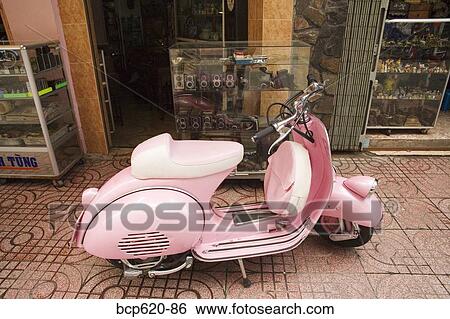 Pink motorbike parked outside shops View Large Photo Image Stock Photograph - Pink motorbike parked outside shops. Fotosearch