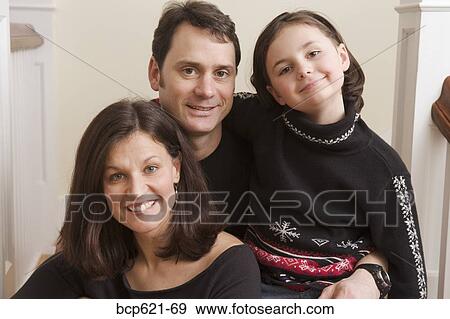 Portrait of couple with young daughter View Large Photo Image Stock Photo - Portrait of couple with young daughter. Fotosearch