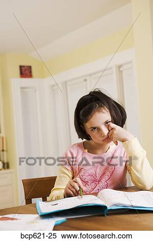 Portrait of girl disgusted by homework View Large Photo Image Stock Photography - Portrait of girl disgusted by homework. Fotosearch