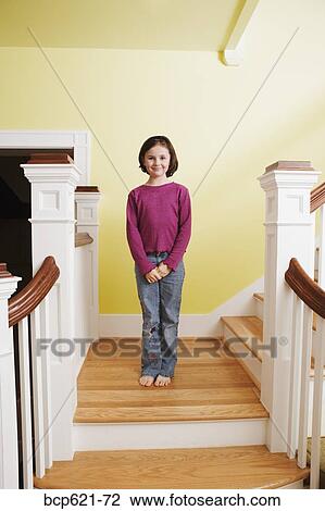 Portrait of young girl on staircase View Large Photo Image Stock Image - Portrait of young girl on staircase. Fotosearch