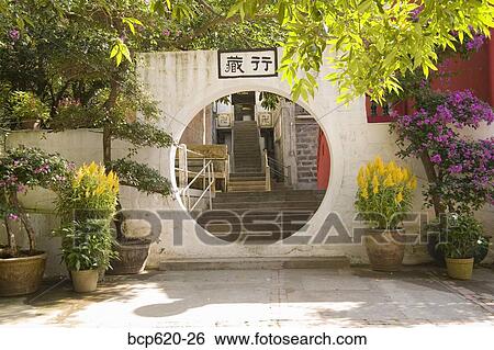 Round doorway at Buddhist monastery in Hong Kong View Large Photo Image Stock Photograph - Round doorway at Buddhist monastery in Hong Kong. Fotosearch
