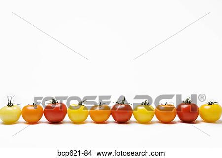 Picture - Row of multicolored tomatoes. Fotosearch