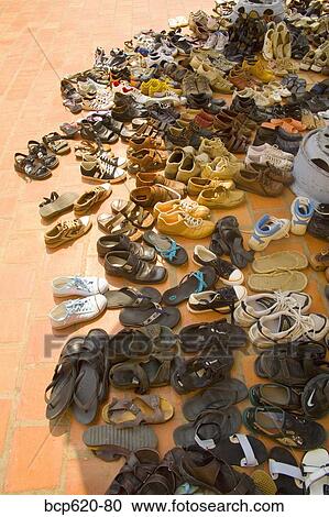 Shoes on bricks outside Vietnamese temple View Large Photo Image Stock Image - Shoes on bricks outside Vietnamese temple. Fotosearch