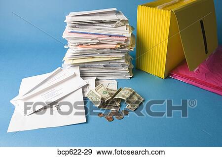 Stack of paperwork and money View Large Photo Image Stock Photo - Stack of paperwork and money. Fotosearch