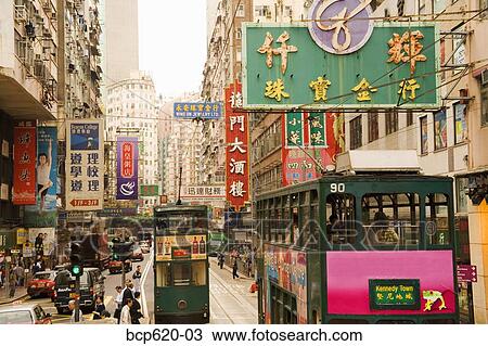 Trams and signs on busy Hong Kong street View Large Photo Image Stock Image - Trams and signs on busy Hong Kong street. Fotosearch