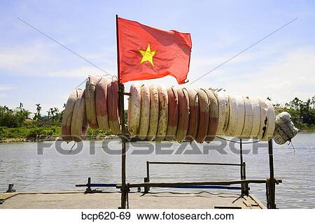 Vietnamese flag and life buoys on river ferry View Large Photo Image Stock Photo - Vietnamese flag and life buoys on river ferry. Fotosearch