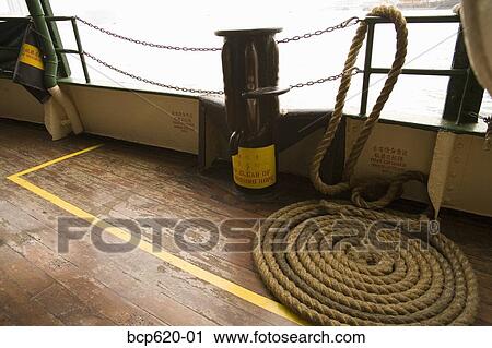 Wooden deck of boat with coiled rope View Large Photo Image Stock Image - Wooden deck of boat with coiled rope. Fotosearch