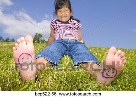 Young girl with smiley faces on bare feet View Large Photo Image Stock Photograph - Young girl with smiley faces on bare feet. Fotosearch