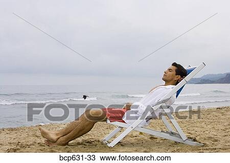 Stock Image - afternoon, caucasian, beach, asian ethnicity, african ethnicity. Fotosearch