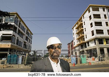 Stock Photo - afternoon, cloudless, blue sky, architecture, african ethnicity. Fotosearch