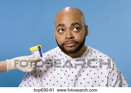 Stock Image - anxiety, fortysomething, embarrassment, attitude, african ethnicity. Fotosearch