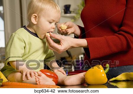 Stock Image - baby, banana, bell pepper, boy, carrot, caucasian. Fotosearch