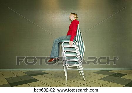 balance, balancing act, caucasian, chair, full body View Large Photo Image Stock Image - balance, balancing act, caucasian, chair, full body. Fotosearch