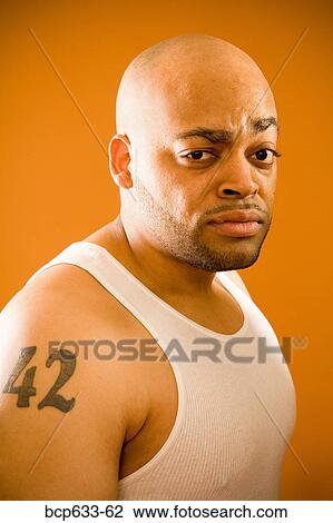 Stock Image - balding, head & shoulders, fortysomething, close up, african ethnicity. Fotosearch