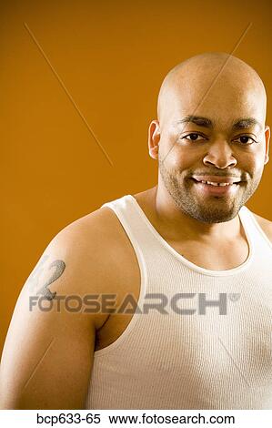 balding, looking at camera, head & shoulders, fortysomething, african ethnicity View Large Photo Image Stock Photography - balding, looking at camera, head & shoulders, fortysomething, african ethnicity. Fotosearch