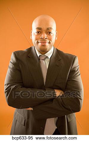 balding, looking at camera, fortysomething, businessman, african ethnicity View Large Photo Image Stock Photography - balding, looking at camera, fortysomething, businessman, african ethnicity. Fotosearch
