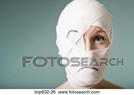 Stock Photograph - bandage, caucasian, close up, cosmetic surgery, face. Fotosearch