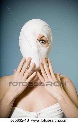 Stock Image - bandage, caucasian, cosmetic surgery, exclaiming, head. Fotosearch