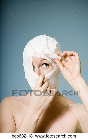 Stock Photo - bandage, caucasian, cosmetic surgery, head, head & shoulders. Fotosearch