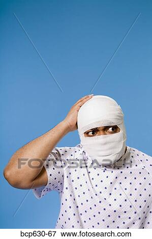 Stock Photo - bandage, gauze, cut out, african ethnicity. Fotosearch