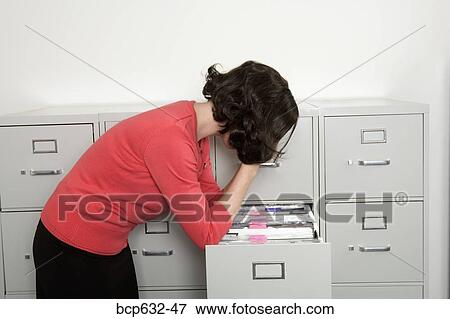 bending, file, caucasian, businesswoman, administrator View Large Photo Image Stock Photo - bending, file, caucasian, businesswoman, administrator. Fotosearch
