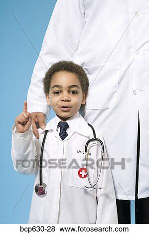 Stock Photo - boy, confidence, childhood, caring, african ethnicity. Fotosearch