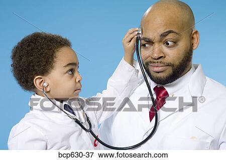 boy, doctor, childhood, caring, african ethnicity View Large Photo Image Stock Photo - boy, doctor, childhood, caring, african ethnicity. Fotosearch