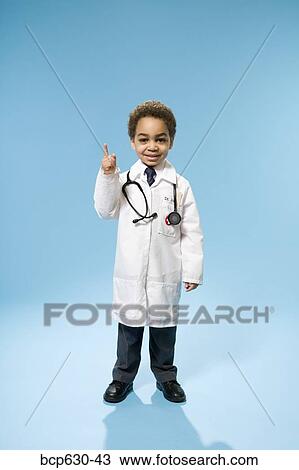Stock Image - boy, education, doctor, childhood, african ethnicity. Fotosearch