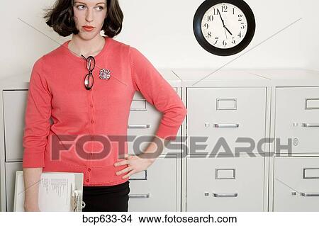 businesswoman, caucasian, clipboard, clock, file cabinet View Large Photo Image Picture - businesswoman, caucasian, clipboard, clock, file cabinet. Fotosearch