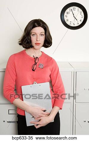 businesswoman, caucasian, clipboard, clock, file cabinet View Large Photo Image Stock Photography - businesswoman, caucasian, clipboard, clock, file cabinet. Fotosearch