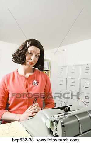Stock Photo - businesswoman, inside, file cabinet, caucasian, administrator. Fotosearch
