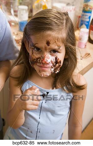 Stock Photography - caucasian, childhood, chocolate, close up, domestic life, elementary age. Fotosearch