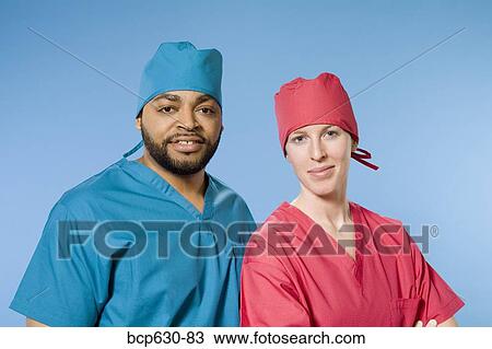 Stock Image - caucasian, education, doctor, co-worker, african ethnicity. Fotosearch