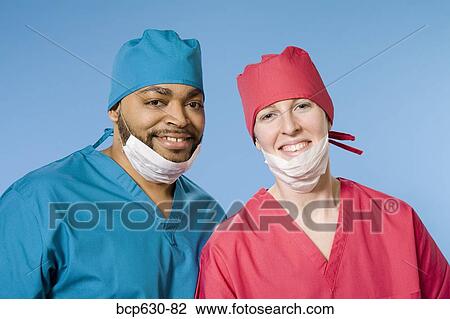 Stock Image - caucasian, fortysomething, doctor, co-worker, african ethnicity. Fotosearch