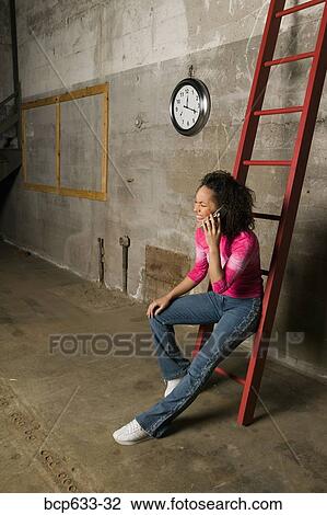 cell phone, inside, full body, clock, african ethnicity View Large Photo Image Stock Image - cell phone, inside, full body, clock, african ethnicity. Fotosearch