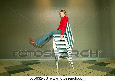 chair, balance, caucasian, blurred, balancing act, african ethnicity View Large Photo Image Stock Image - chair, balance, caucasian, blurred, balancing act, african ethnicity. Fotosearch