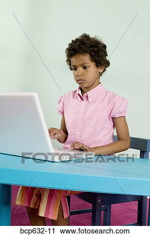 childhood, education, concentrating, computer, african ethnicity View Large Photo Image Stock Image - childhood, education, concentrating, computer, african ethnicity. Fotosearch
