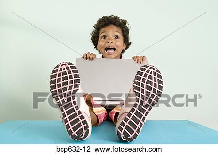 childhood, elementary age, education, computer, african ethnicity View Large Photo Image Stock Image - childhood, elementary age, education, computer, african ethnicity. Fotosearch