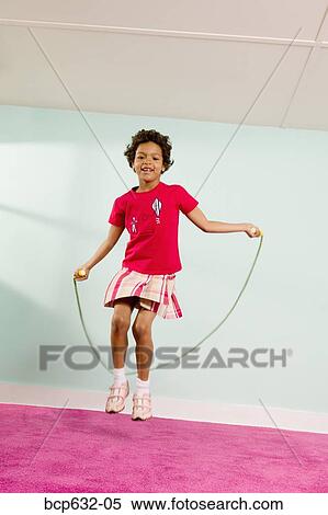 Stock Photography - childhood, full body, exercise, elementary age, african ethnicity. Fotosearch