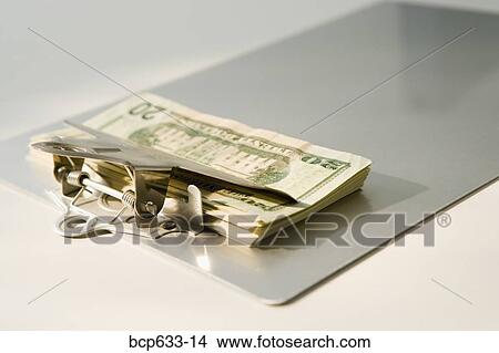 Picture - clipboard, dollar, finance, money. Fotosearch