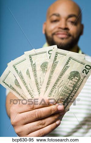 Stock Photography - close up, fortysomething, finance, african ethnicity. Fotosearch
