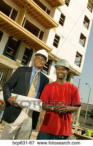 co-worker, afternoon, businessman, business, blueprint, african ethnicity View Large Photo Image Stock Photo - co-worker, afternoon, businessman, business, blueprint, african ethnicity. Fotosearch