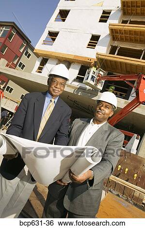 co-worker, afternoon, businessman, business, blueprint, african ethnicity View Large Photo Image Stock Photograph - co-worker, afternoon, businessman, business, blueprint, african ethnicity. Fotosearch