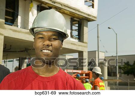 construction site, afternoon, construction, co-worker, background people, african ethnicity View Large Photo Image Stock Photo - construction site, afternoon, construction, co-worker, background people, african ethnicity. Fotosearch