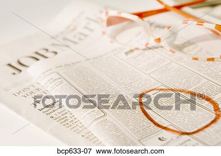 Stock Photo - employment, circle, close up, classifieds, circling, advertisement. Fotosearch